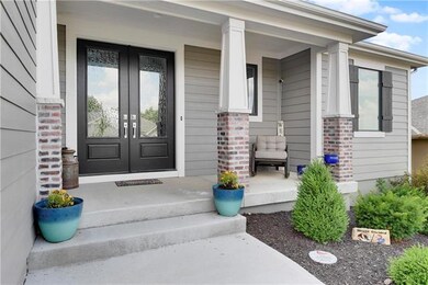Great front porch with double door entry