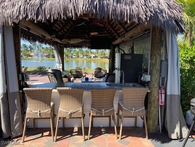 View of patio with outdoor dry bar and a gazebo