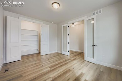 Unfurnished bedroom featuring light wood-style floors and a closet