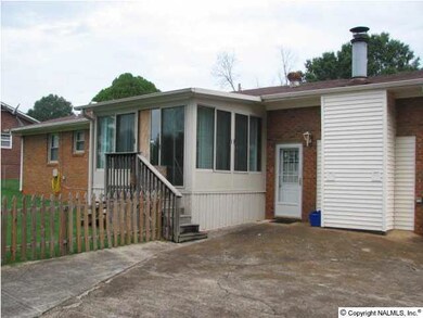 View of back of home with sunroom