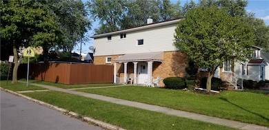 Fully fenced yard with 2 car detached garage.