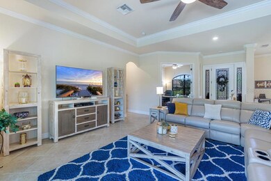 Living room with view into office/den area