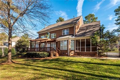 Rear view of large deck and screened in porch.