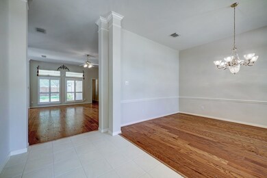 Entry with high ceilings, view of dining room and  family room.
