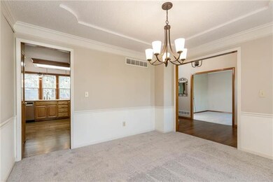 Dining room off the entrance and kitchen.