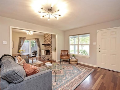 Living area featuring a chandelier, wood finished