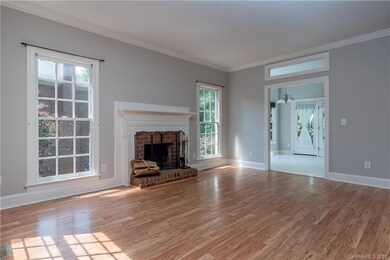 Living room with wood burning fireplace