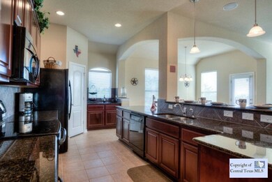 Kitchen: Large Open Kitchen is perfect for entertaining. Open to Living and Dining areas.