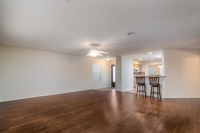 Kitchen is open to family room that overlooks the large backyard.