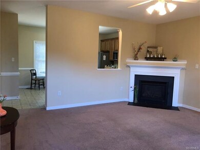 Living room opens to eat-in kitchen