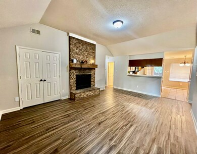 Unfurnished living room with dark wood-type floori