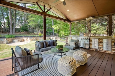 Covered outdoor oasis with vaulted ceiling, built-