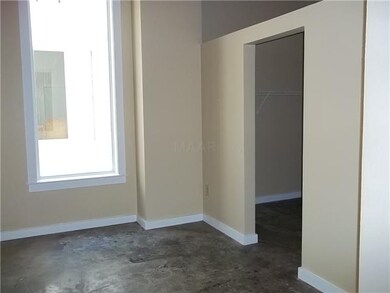 The Master Bedroom has vaulted ceilings, concrete 