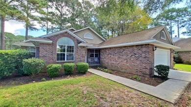 View of front of house featuring a garage and a fr
