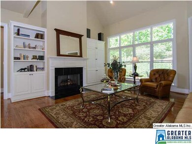 Sunny great room with 2 story ceiling, fireplace a
