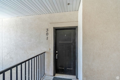 Property entrance with stucco siding