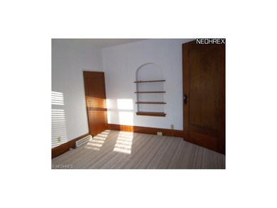 Lower Unit Bedroom 1 with built-in shelving, newer