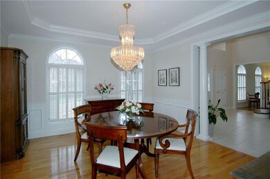 Dining Room - Hardwood floors, decorative pillars,