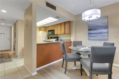 Dining space with a chandelier, baseboards, light 