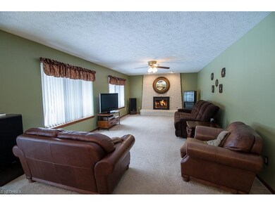 Spacious family room with beautiful brick fireplac