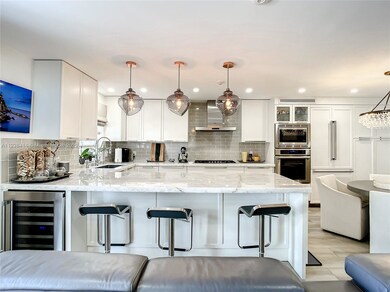 Kitchen/ Counter top with bar stools / wine cooler
