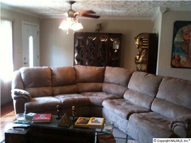 Great room hosts beautiful wood flooring, new lighting and new front door.