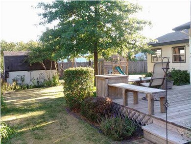 Nicely landscaped back yard with privacy fence and