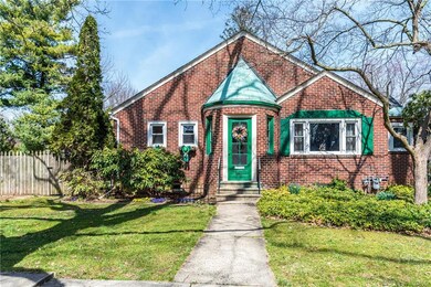 Tudor Revival Brick Cape Cod