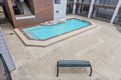 Community pool with a patio