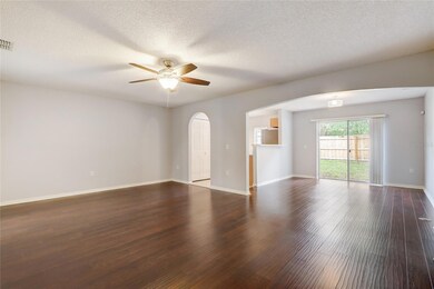 LIVING ROOM WITH KITCHEN AND DINNIG ROOM VIEW