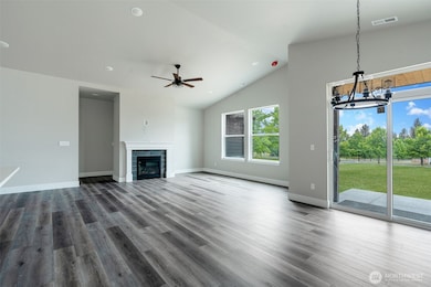 Great room with fireplace and ample natural lighting