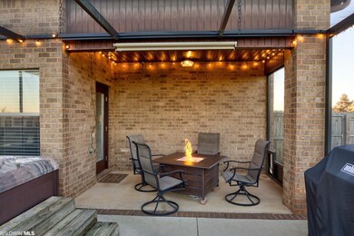 Porch is extended with shade and hot tub
