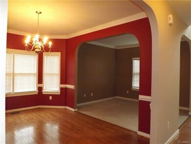 Beautiful Living Room or Office/Study with arched doorways.