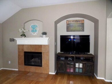 Gas log fireplace and Flat screen niche.