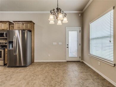 The dining area has a large picture window