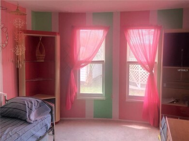 A whimsical second bedroom has a large closet and 