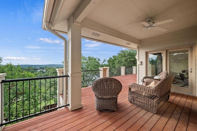 Wooden deck featuring ceiling fan