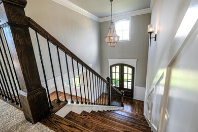 Dramatic two-story foyer greets you. Open concept with 3/4