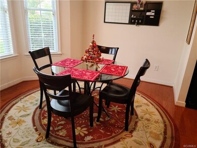 Eat In Kitchen area with Bay Window and hardwood f