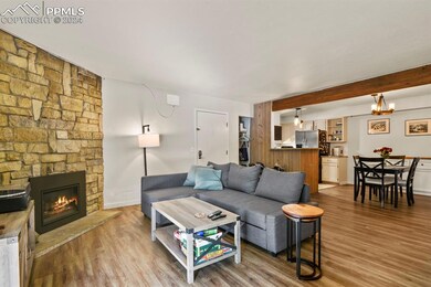 Living room featuring an inviting chandelier, a st