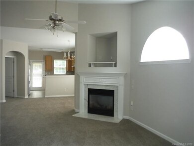Great Room with gas log fireplace, vaulted ceiling