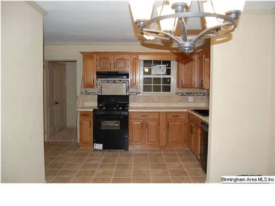 Another view of the kitchen leading to the hall wi