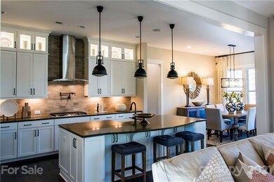 GOURMET KITCHEN WITH WHITE CABINETS, QUARTZ COUNTE