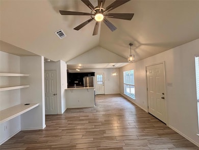 Unfurnished living room with wood finished floors