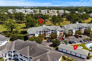 Aerial view of apartment complex and a golf club