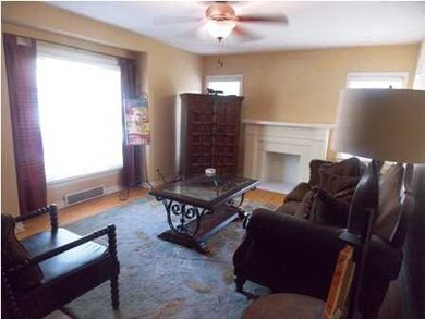 Large living room with wood floors.