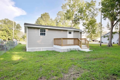 Rear view of property with a deck