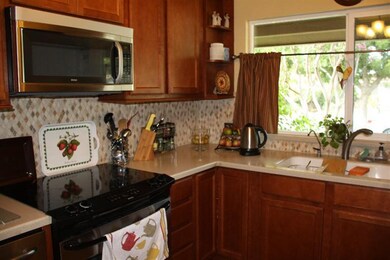 Kitchen has stainless appliances and a new back sp