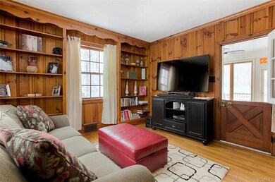 Cozy Den Area with Built In Bookshelves and Dutch 