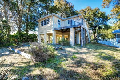 Back view of home from the water. Upper deck. Unde
